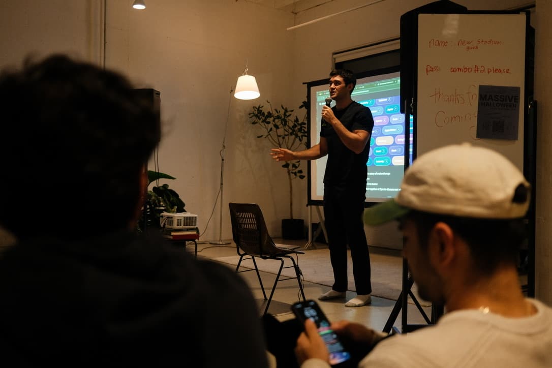 A speaker presenting on demo day